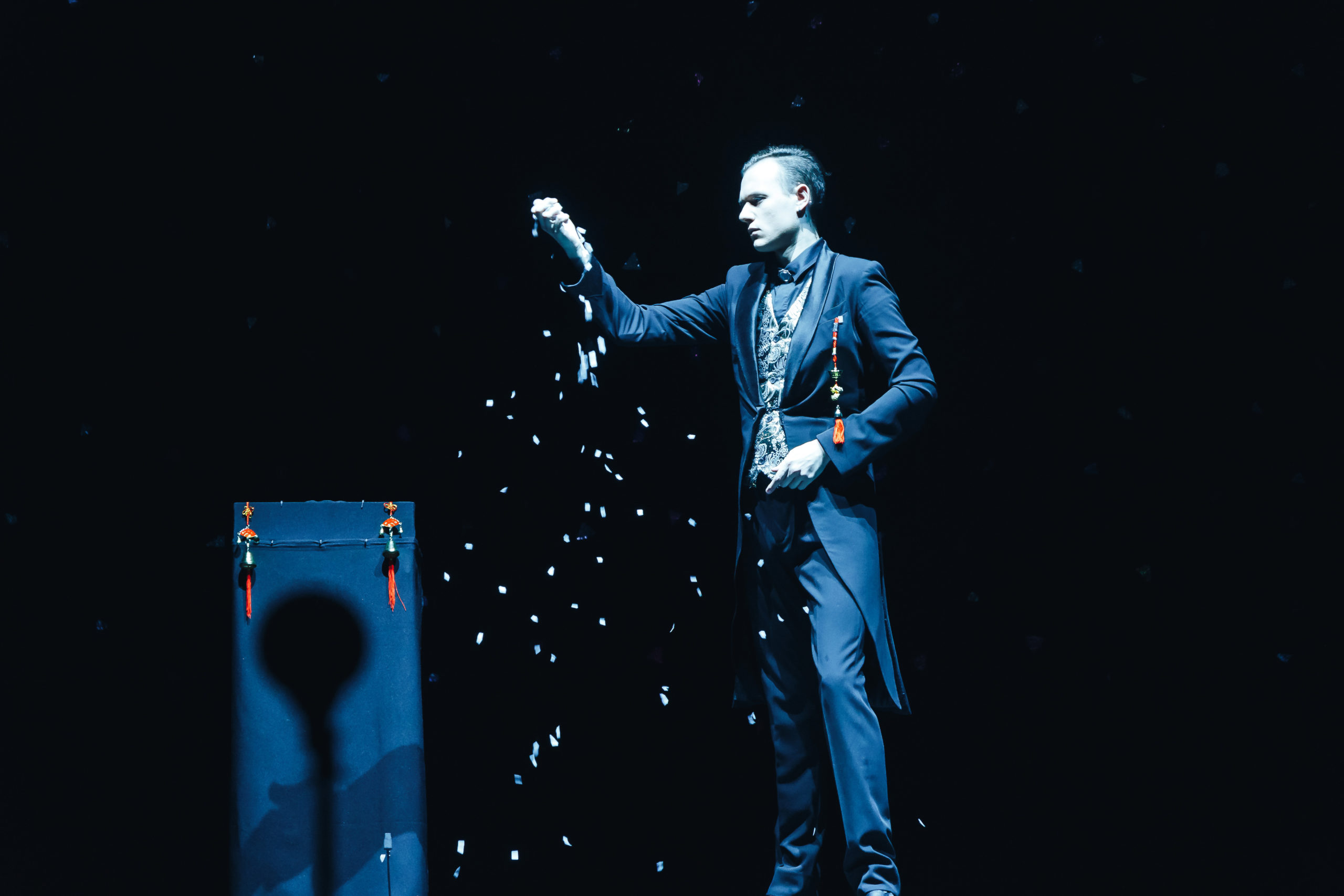 Magician performing a trick on stage