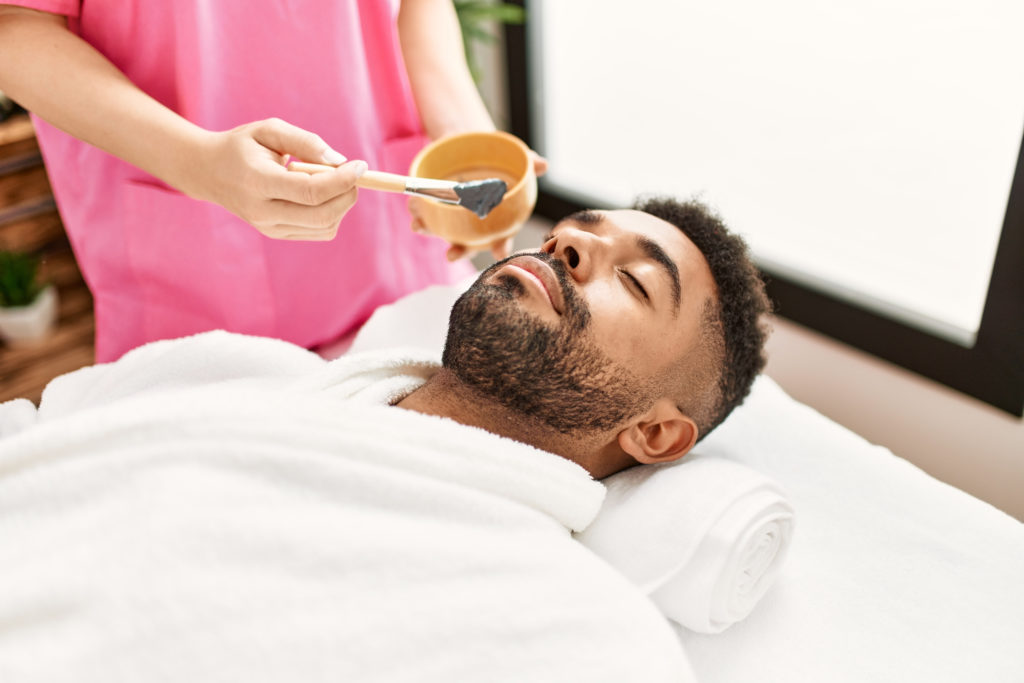 5 Irresistible Covid-Careful NYC Spas: Man receives a facial treatment at a spa